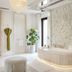 Jumeirah Dar Al Masyaf Dubai spa bathroom with marble soaking tub, glass shower and bench