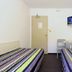 Hotel Enzo Green Clermont Ferrand, Coude room with two single beds and wall-mounted TV in Coudes