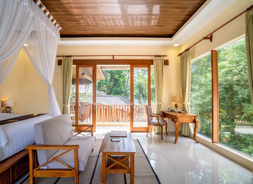 Ashoka Tree Resort at Tanggayuda, Ubud: airy villa room with canopy bed, desk and forest views