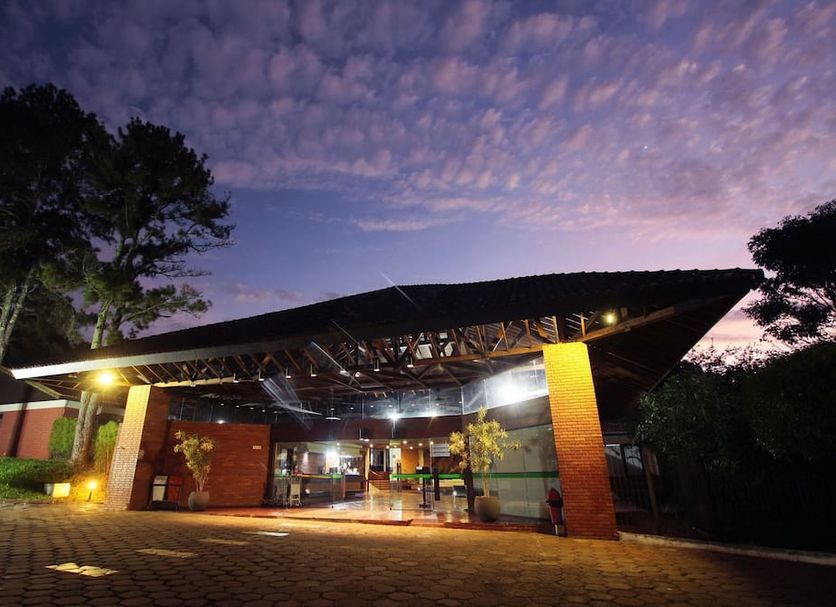 Hotel Colonial Iguaçu in Foz do Iguaçu exterior entrance at dusk with illuminated covered driveway