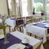 Hotel Haus Schons in Mettlach dining room with set tables and large windows