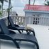 La Isla Resort, Caye Caulker: seaside terrace with lounge chairs and ocean view