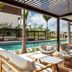 Silversands Grand Anse in St. George's: shaded poolside terrace with lounge chairs and ocean view