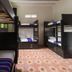 Rosa Mexicano Hostal in Mérida dorm room with bunk beds and floral floor tiles