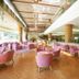 Akiu Resort Hotel Crescent in Sendai lobby with pink lounge chairs, wood floor, and tall windows