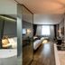 Hotel28 Myeongdong Seoul room with bed, desk, mirror, and city window view