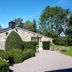 B&B La Buissonniere in Ferrières, stone countryside cottage with gravel driveway and manicured shrubs