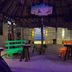 Hotel San Julio in Celestún beachside palapa bar with colorful seating and ocean view