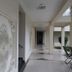 Seven Sky Clarks Exotica, Bhuj: bright indoor corridor with ornate wall art and tiled floor