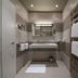 Moma1890 Boutique Hotel Munich bathroom with double sink, large mirror, towel warmer and modern shower