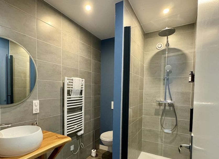 Hôtel La Maison des Dunes bathroom in Erdeven with walk-in shower, vessel sink and heated towel rail