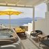 Myconian Korali Relais & Chateaux in Mykonos with hot tub, lounge chairs, and sea view