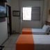 Frimas Hotel, Belo Horizonte: twin guest room with two beds, wall-mounted TV, and window.