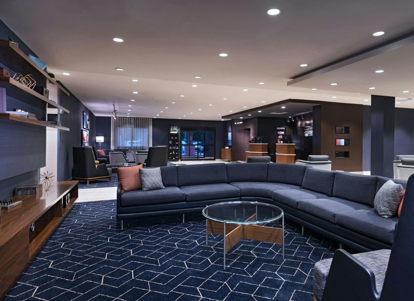 Courtyard by Marriott Scottsdale Old Town lobby with curved sectional seating and glass coffee table