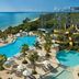 Dreams Natura Resort & Spa in Puerto Morelos with pools, palm trees and waterslides by the ocean