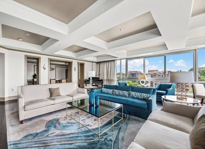 The Tennessean Hotel Knoxville suite with city views, modern seating area, and large windows
