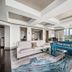 The Tennessean Hotel Knoxville suite with city views, modern seating area, and large windows