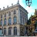 Hotel Les Portes D'Or in Nancy, ornate historic facade with arched windows and decorative gate