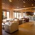 Reserva del Saja Hotel & Spa in Renedo de Cabuérniga lounge with bar, stone column and wood ceiling