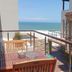 Brenton On The Rocks in Brenton-on-Sea with sea-view balcony and outdoor dining set