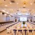 Van Phat Riverside Hotel in Can Tho conference ballroom with banquet tables and stage