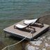 The Lakeside Prince Edward County waterfront deck with two lounge chairs by the water