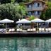 Hotel Melisa in Bozburun with waterfront sun loungers, white umbrellas, and sea view