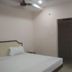 Abirami Inn Kumbakonam guest room with double bed, ceiling fan, and doorway to bathroom