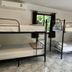 Phangan Great Bay Resort in Ko Pha Ngan bunk-bed dorm room with window and marble floor