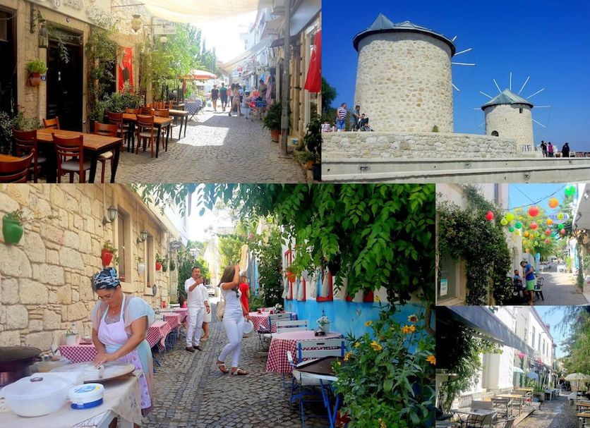 Vintage Alacati in Alacati: stone courtyard dining, colorful street, and windmills under blue sky