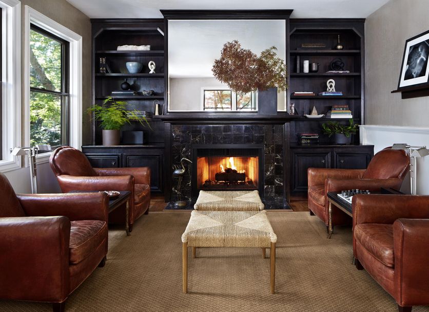 Gaige House in Glen Ellen lounge with leather armchairs, fireplace, and built-in shelves