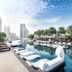 Grande Centre Point Terminal 21 Bangkok rooftop infinity pool with city skyline and loungers