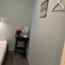 Svea Hostel Stockholm simple single room with bed, bedside table, lamp and fan