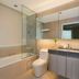 Somerset Medini Iskandar Puteri bathroom with bathtub, glass shower, toilet and vanity in Gelang Patah
