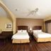 Holiday Inn Express & Suites Seguin guest room with two beds and large window