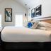 Winslow's Bungalows in Key West guest room with king bed, chaise lounge and vaulted ceiling