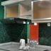 High Point Surabaya kitchen counter with kettle, cups and water bottles against green tiled backsplash