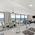 Sandpiper Beacon Beach Resort in Panama City Beach living area with ocean view, balcony, and kitchen island