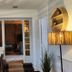 Le Clos Loret in Saint-Germain-du-Corbéis: cozy dining room with wicker pendant lights and open doorway