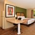 Extended Stay America Suites - Nashville - Airport - Elm Hill Pike guest room with bed, desk and armchair