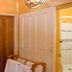 Guest House Mooigezicht in Clarens: bathroom entrance with shower, towel rack and wooden door