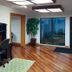 Motel 6 Little Rock, Ar - Airport lobby with wood floors, desk area, potted plant and glass entrance