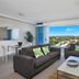 Silvershore Apartments on the Broadwater in Biggera Waters with sofa seating and a wide water view