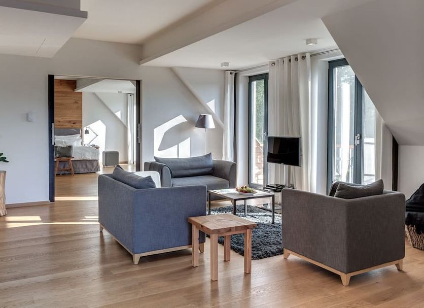 Hotel Strandhaus - Boutique Resort & Spa in Lübben, lounge seating area with large windows and lake views