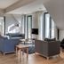 Hotel Strandhaus - Boutique Resort & Spa in Lübben, lounge seating area with large windows and lake views