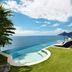 The Ungasan Clifftop Resort in South Kuta with infinity pool, loungers and ocean views
