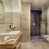 Hotel Leitner in Rio di Pusteria bathroom with walk-in shower, vessel sink, and towel radiator