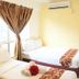 Sun Inns Hotel Lagoon in Petaling Jaya guest room with two beds, window curtains, and wall-mounted air conditioner