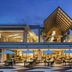 Le Méridien Khao Lak Resort & Spa courtyard dining terrace with lit tables and open-air pavilion