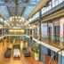 Quayside Hotel Malacca atrium lobby with hanging lights, mezzanine walkways and seating